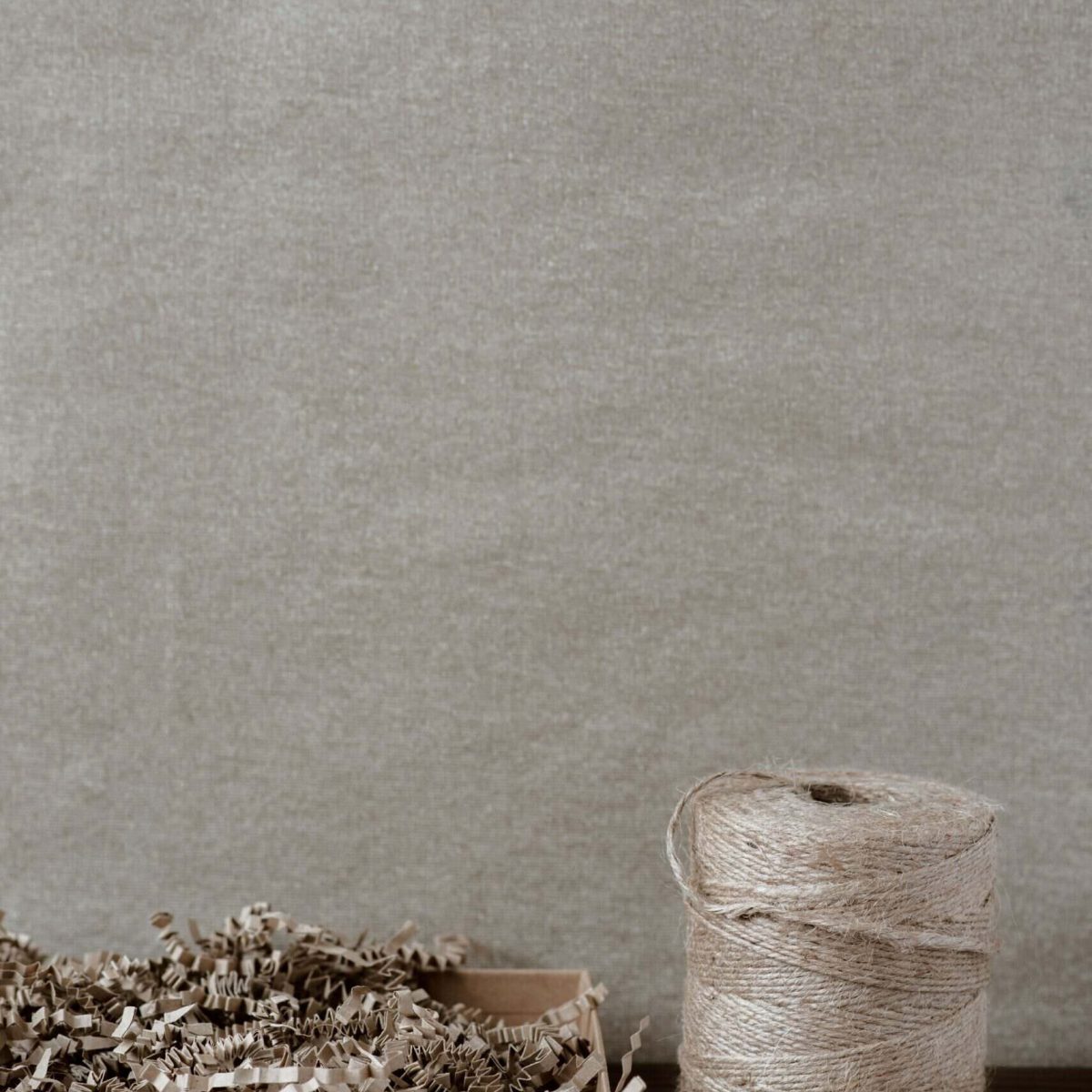 Image of shredded paper and twine spool for document destruction.