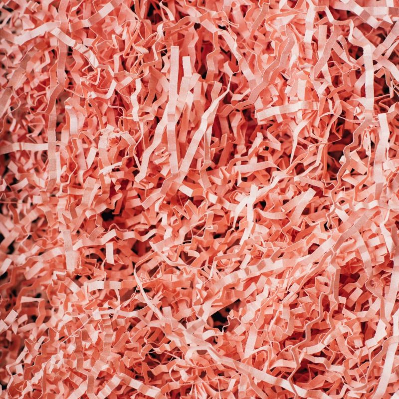 Pink shredded paper for packaging and shredding services in South Africa.